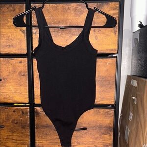 (xxs teens) Black One Piece with thong back.